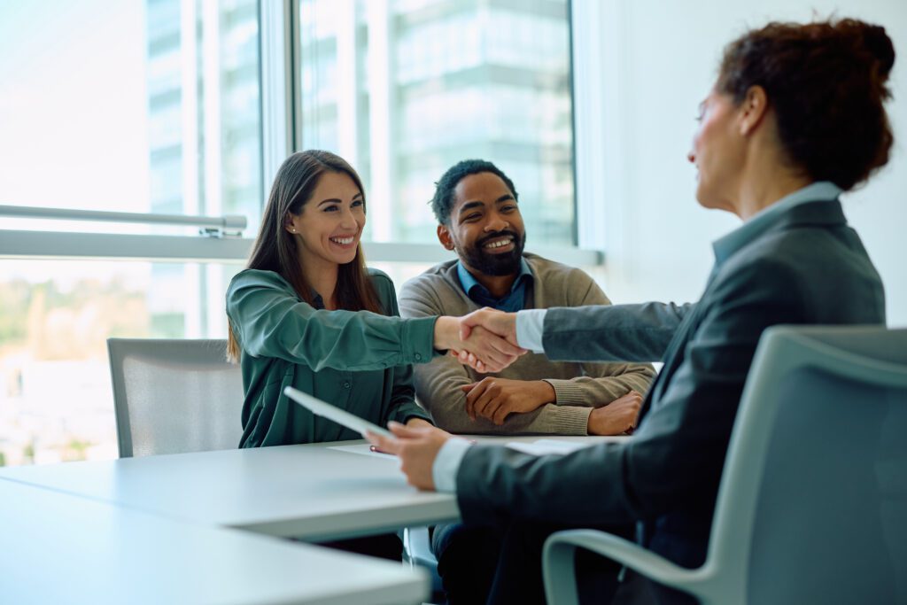 Woman shaking hands in a business meeting