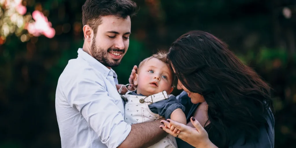 Young family with baby representing life insurance and mortgage protection for loved ones