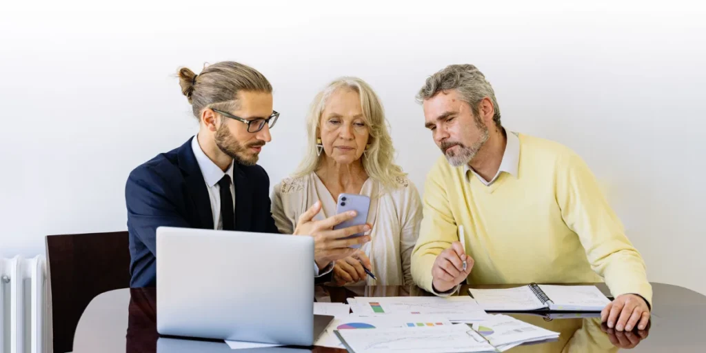  Insurance advisor discussing mortgage protection and life insurance options with homeowners